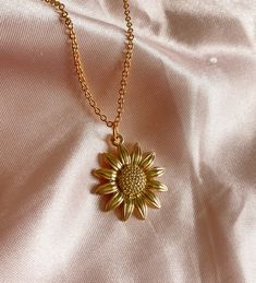 "Our favorite, this cute Sunflower charm Necklace in gold! 🌻 Hand made by Holly from Tumbled Shop with a gold tone pendant of a yellow sunflower and hung on a 14K gold plated chain 18\" long.  We are honored you are here! Thank you for supporting our small business and unique healing creations. Orders over $50 get free shipping in the US & a Free TumbledShop sticker! 🔮To stay updated with new items follow us on Instagram @Tumbledshop OR Click the link below! 🌻 https://www.instagram.com/tumbledshop/ ** Remember to FAVORITE the Tumbled Shop as I add inventory daily! (Click the heart next to our shop name). ❤️" Gold-plated Flower-shaped Jewelry, Yellow Sunflower Design Jewelry Gift, Tarnish Resistant Gold Flower Pendant Jewelry, Dainty Yellow Flower Shaped Jewelry, 14k Gold Filled Flower Necklace, Gold Tarnish-resistant Flower Pendant Jewelry, Tarnish-resistant Gold Flower Pendant Jewelry, 14k Gold-filled Flower Necklace, Everyday Gold Plated Flower Pendant Necklace