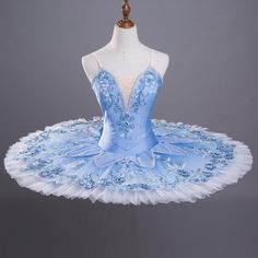 a blue and white ballet dress on display