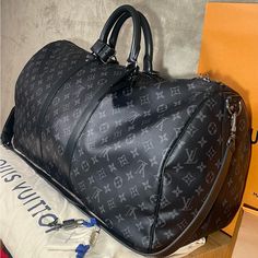 Purchased Directly From Louis Vuitton Store At Cherry Creek Mall In Denver Co Beautiful Duffle I’ve Used It 2/3 Times Never Got The Initials On The Tag So It’s Not Personalized Never Used The Lock Or Key So No Scratches Overall It’s An Amazing Duffle Will Send With Original Receipt And Original Packaging Black Large Capacity Monogram Canvas Bag, Luxury Black Monogram Canvas Bags, High-end Black Monogram Canvas Bag, Black Monogram Canvas Travel Bag, Black Monogram Canvas Bag For Everyday Luxury, Black Monogram Canvas Luxury Bag, Black Signature Coated Canvas Travel Bag, Formal Black Signature Coated Canvas Bag, Louis Vuitton Duffle Bag