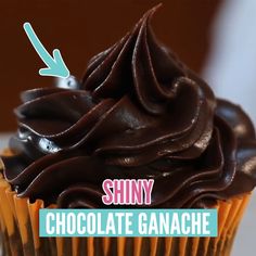 a cupcake with chocolate frosting and an arrow pointing to shiny chocolate ganache