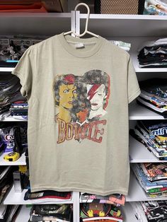 an old t - shirt is on display in a store