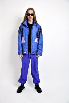 "90s retro nylon windbreaker jacket for men in blue colour by The Flagship. Size - XL (54). Model is 187 cm / 6ft 1.6\" tall and usually wears size M. Used but quite good vintage condition. All orders are shipped every day Worldwide from EU. Safe registered standard delivery Worldwide with courier and tracking number. You can also choose super fast 1-4 days DHL Express delivery. Just choose shipping upgrade in your cart.❗️Don't forget to write your phone number. It will be used only for delivery Retro Blue Nylon Windbreaker, Retro Blue Windbreaker For Streetwear, Blue Retro Windbreaker For Streetwear, 90s Blue Windbreaker For Streetwear, 90s Style Hooded Blue Windbreaker, 90s Style Blue Nylon Track Jacket, 90s Style Blue Track Jacket For Outdoor, Blue Retro Windbreaker For Outdoor Activities, Retro Windbreaker