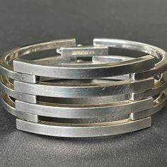 Absolutely fantastic heavy solid 925 sterling silver cuff bracelet with an Art Deco geometric design signed by Italian fine jeweller Orlando P. Orlandini, possibly for Italian company Uno a Erre. The has a slim fitting horizontal and vertical diameter, so please check the photos and required wrist measurements carefully. It fastens with a secure double hook-over clip clasp with safety catches. The interior of the clasp is stamped 925 for sterling silver and signed with hallmarks. The piece weighs 67 grams altogether. The bracelet is in very good vintage condition - it is ready to wear and feels beautiful and smooth on the wrist. Art Deco Geometric, Modernist Jewelry, Modernist Design, Sterling Silver Cuff Bracelet, Sterling Silver Cuff, Silver Cuff Bracelet, Silver Cuff, Silver Wedding, Vintage Italian