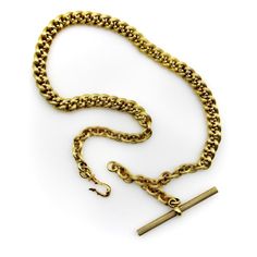 This is part of Chairish’s Fine Jewelry assortment.  This 14k gold watch chain has a fabulous hollow link interwoven with tiny balls for an unusual variation of a curb link. The links are carved with a ribbed texture that give a matte surface to the gold. This creates a unique visual texture that almost gives the illusion that the lines of the chain are blurry or out of focus. The tiny balls add a vertebrae-like element that reinforces the chain and make its movement serpentine.   At each end of Vintage 14k Gold Necklaces With Curb Chain, Antique Jewelry With Oval Link Curb Chain, Classic Antique Gold Chain Jewelry, Formal Wheat Chain Link Necklace, Antique Yellow Gold Figaro Chain Necklace, Antique Oval Link Gold Chain Jewelry, Victorian Link Jewelry With Curb Chain, Antique Gold Jewelry With Curb Chain, Victorian Gold Curb Chain Jewelry