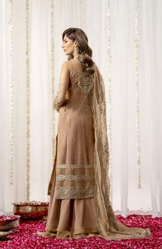 Luxury Beige Embroidered Pakistani Wedding Dress Gown Style Pishwas is an ethereal creation that's a work of art. Ice blue tulle comes alive with scintillating florals, and iridescent details accentuate the overall composition. Hand-placed sequins, crystals, and seed pearls add a touch of glamour to the silver and silk thread-worked blooms. The dreamy organza dupatta features intricately embroidered borders. Pishwas Frock: This Pishwas Frock comes in premium net fabric and is emblazoned with Lav Wedding Anarkali Embroidered Georgette Dress, Embroidered Embellished Dress For Wedding, Embellished Net Dress With Traditional Drape, Embroidered Georgette Dress With Dupatta For Wedding, Wedding Embroidered Georgette Dress With Dupatta, Semi-stitched Organza Gown For Eid, Organza Embroidered Dress With Dabka Work For Reception, Net Dress For Reception On Eid, Eid Semi-stitched Organza Gown