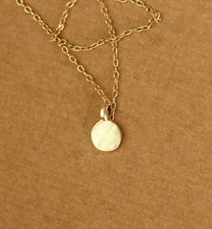 Tiny gold dot necklace - everyday necklace - dainty necklace - dot necklace - circle necklace - a tiny gold disc on a 14k gold vermeil chain This dainty and delicate 22k gold vermeil dot hangs from a 16 inch 14k gold vermeil chain.. Please feel free to select a different length if you prefer! Need an energy boost? Or a little pop of color? https://www.etsy.com/listing/165088081/add-a-gemstone-power-boost-healing-gem?ref=shop_home_active The Hand (Khamsa), particularly the open right hand, is a s Dot Necklace, Necklace Everyday, Gold Dot, Gold Disc, Energy Boost, Everyday Necklace, Gold Dots, Circle Necklace, Necklace Dainty