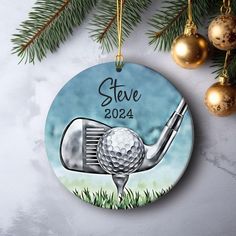 a golf ornament hanging from a christmas tree