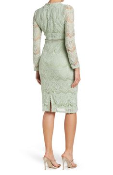 Chic lace constructs this adorable long sleeves dress, a perfect pick for your next soiree. 42" length (size S) Crewneck Long lace sleeves Sheer lattice waist panel Lined Self/lining: 100% polyester Machine wash Imported Model's stats for sizing: - Height: 5'9" - Bust: 34" - Waist: 23" - Hips: 35" Model is wearing size S. Elegant Lace Dresses With Lace Cuffs, Fitted Long Sleeve Dresses With Scalloped Lace, Fitted Midi Length Dresses With Lace Cuffs, Spring Elegant Lace Dress With Lace Cuffs, Elegant Spring Lace Dress With Lace Cuffs, Elegant Lace Dress With Lace Cuffs For Spring, Formal Spring Dress With Lace Cuffs, Formal Dresses With Lace Cuffs For Spring, Long Sleeve Lace Midi Dress With Scalloped Lace