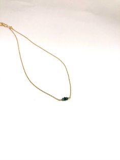 Dainty Emerald 14k gold necklace, May birthstone, handmade craft jewelry, tiny gemstone necklace, healing power gemstone, bring love & luck D E T A I L S - 14k gold filled necklace. - A tiny emerald bead wrapped with 14k gold filled wire. - An adjuster chain with large sized-links (approximately 1.5 inches) allows for easy clasping and sizing. . LENGTH - Please select from the drop down selection to choose 14 or 16 inch length. - The standard length is 16 inch length. ∙ EXTRA LOVE & ALOH Emerald Bead, Craft Jewelry, May Birthstone, 14k Gold Necklace, Beaded Wraps, Healing Power, Healing Powers, Gemstone Necklace, Handmade Crafts