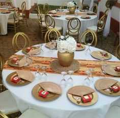 a table set up with plates and place settings