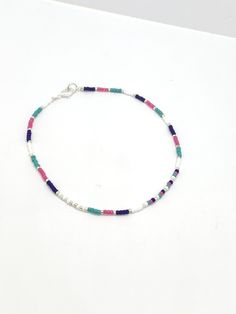 Turquoise, royal blue, pink and white seed bead anklet Dimensions Seed beads are 2mm glass Plated findings An extender is available Postage: UK: Items are sent 2nd class mail, but can be upgraded to 1st class mail for a small fee at checkout. International orders are sent by Standard Royal Mail - untracked. An upgrade is available at checkout. Thank you for visiting and please come back again. If you have any queries, please don't hesitate to contact me. Beaded anklet women, colourful bead ankle Gift Anklets With Tiny Beads, Dainty Colorful Beads Anklets As A Gift, Dainty Anklets With Colorful Beads As Gift, Dainty Colorful Beaded Anklets As Gift, Multicolor Round Beads Anklets As Gift, Multicolor Round Beads Anklets For Gift, Gift Multicolor Round Beads Anklets, Gift Multicolor Round Bead Anklets, Multicolor Beaded Chain Anklets As Gift