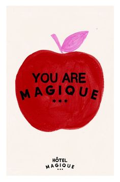 an apple with the words you are magique written on it's side in black ink