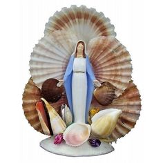 the statue is surrounded by shells and seashells