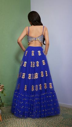 Introducing Artworq, a stunning iris blue lehenga designed to make you feel like royalty on your special day. Exquisitly crafted from a soft tulle base and embellished with shimmering glass crystals and intricate glass-cut beaded embroidery. The matching blouse features a stylish and modern cut, the piece comes with a matching dupatta, adorned with glass crystals and glass-cut beaded embroidery. From Papa Don’t Preach’s Capsule collection. DELIVERY TIMEPlease allow 8-12 weeks for your outfit to Traditional Hand Embellished Blue Choli, Blue Hand Embellished Choli For Reception, Blue Hand Embellished Sharara For Reception, Blue Hand Embellished Floor-length Choli, Blue Hand Embellished Fitted Sharara, Blue Hand Embellished Choli For Party, Blue Hand Embellished Traditional Gown, Traditional Blue Hand Embellished Gown, Festive Blue Hand Embellished Choli