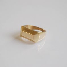 Gold Signet Ring, Signet Ring Women's, Gold Rings For Women, 14k Gold Ring, Geometric Ring, Unique Gifts For Women, Valentines Gifts For Women This signet ring is a flat top ring, a rectangular shaped. I designed this signet ring in an elegant geometric form.  This signet ring is a beautiful statement ring, made of solid 14k gold. This signet ring has a strong presence. This ring is a beautiful pick up for a daytime apparel and perfect for a night out in town.  This 14k gold ring makes a genuine statement that can not be ignored! I sculptured this ring in wax to perfection and molded it in one piece.  The ring has a classic shape that combines comfort and beauty to make this jewelry perfect for you or anyone you care!   Features  ❇ Made of solid 14k yellow/white/rose gold (Choose during ch Signet Rings Women Gold, Gold Coin Ring, Ring Geometric, Gold Rings For Women, Greek Ring, Signet Rings Women, Silver Necklace Simple, Handmade Jewelry Earrings, Artisan Rings