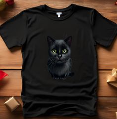 This stylish and minimalist black cat t-shirt is the perfect choice for cat lovers! Enjoy all-day comfort with its soft fabric, while the striking cat design showcases your unique style. A must-have for pet fashion enthusiasts, this tee is ideal for those who appreciate simple elegance. Perfect for everyday wear or as a thoughtful gift, this t-shirt is sure to become a favorite among animal lovers. Designed specifically for black cat fans, it's a wardrobe essential that's both chic and comfortab Black Cat Yellow Eyes, Cat Tee Shirts, Yellow Cat, Pet Fashion, Cat Sweatshirt, Cat Tee, Yellow Eyes, Cat Shirt, Cat Shirts