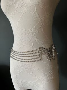 Very High Quality Chain Belt with Austrian Rhinestones. Strong Silver Chain.  Butterfly Detail and Butterfly Tail Drop to the Chain.  This Belt is another Limited Edition of only 100 pieces designed by the FAN Fashion Team.  Adjustable to UK Size 8-16 Elegant Silver Metal Chain Belt, Elegant Metal Waist Chain For Party, Elegant Silver Chain Belt For Evening, Silver Chain Belt For Evening, Silver Crystal Waist Chain For Party, Metal Rhinestone Necklace With Chain For Evening, Silver Chain Belt For Party, Elegant Silver Crystal Waist Chain, Elegant Silver Chain Belt With Rhinestones