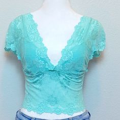 Bebe Beautiful Summer Turquoise Lace Crop Corset Woman Top, Plunging Neckline, Adjustable Fit With Three Lines Of Hook Closure, Cap Sleeves. Can Be Dressed Up With A Blazer Wide Lag Pants And Kitten Heels Or Cute Skirt Or Dress Down With Jeans. Pretty And Versatile. Size: Medium Condition: New With Tags The Item Will Be Shipped As Shown In All The Photos, Please See Every Photo For Exact Item Description. Ships From A Smoke Free Home Please See All Photos For Exact Item Condition Thanks For Visi Low-cut Blue Summer Tops, Fitted Blue Lace Top, Blue Fitted Lace Top, Blue V-neck Tops With Built-in Bra, Fitted Turquoise Tops For Spring, Fitted Light Blue Lace Tops, Turquoise Lace, Woman Top, Cute Skirts