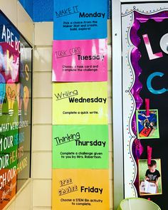 colorful bulletin boards are hanging on the wall in front of a classroom door with writing