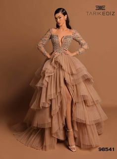 Tarik Ediz 98541 - Beaded Tiered Skirt Gown Long Sleeved Tiered Dress, Tulle Couture Dress, Cream Gowns Elegant, Tarik Ediz Wedding, Wedding Guest Ball Gown, Goddess Exclusive Dress, Iconic Long Dresses, Full Sleeves Dresses For Women, Versailles Ball Gown