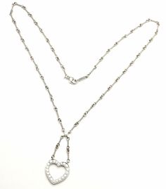 About This Piece: Metal: Platinum Measurements: Chain Length: 16.5"Drop: 1 1/4" Weight: 11.3 grams Pendant:Stones: 17mm x 16mm Round brilliant cut diamonds VS1 clarity, G color total weight approx. .67ct Hallmarks: Tiffany & Co PT950 T2550odad Open Heart, Heart Pendant Necklace, Round Brilliant Cut Diamond, Brilliant Cut Diamond, Tiffany & Co., Stone Pendants, Chain Lengths, Round Brilliant, Chain Length