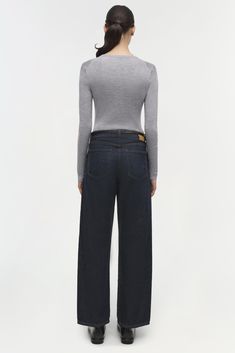 PRE-FALL 2024 WOMEN'S COLLECTION The Sawyer Jean in Twilight. These jeans feature a high waist and a relaxed fit that tapers towards the ankle, providing a modern and comfortable silhouette. The deep indigo wash adds a touch of sophistication, making them versatile enough for both casual and dressier occasions. January Jones, Twilight Blue, Deep Indigo, Knitwear Tops, Fall 2024, Shop Swimwear, Pre Fall, The Deep, Cotton Poplin