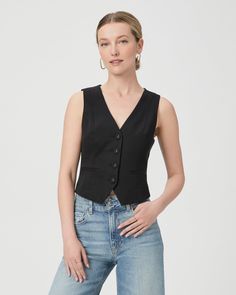 Made from a supremely soft cotton blend, this sleeveless black vest top is designed with front princess seams, covered buttons, welt pockets, and a front and back notch. Pair the Iris Vest with any shade of denim. | Iris Vest Top - Black | Size 12 Classic Spring Vest, Fitted Sleeveless Sweater Vest With Button Closure, Chic Sleeveless Denim Vest For Work, Sleeveless Cotton Workwear Vest, Elegant Cotton Sleeveless Blouse Vest, Fitted Cotton Tank Top With Pockets, Fitted Button Closure Tank Top For Work, Chic Denim Vest For Workwear, Chic Denim Vest For Work