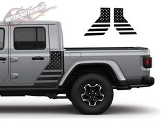 a gray jeep with an american flag decal on it