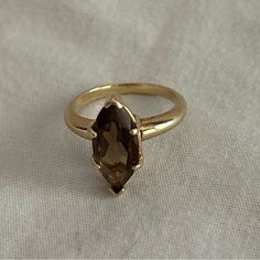 Classic (Maybe Vintage) Smoky Topaz Or Quartz Ring. Not 100% Sure If It's Topaz Or Quartz. Gold Band, Nice Weight. There Are No Markings That Read 10-14-18 Karat So I'm Not Certain Which It Is.Looks Like Some Of My 14 K Pieces If I Had To Guess. Size 6.5 See Pics On The Ring Sizer For Exact Size See Pics For Color. It's A Beautiful, Brownish/Amber Stone. Smoke Free Home. Small Dog Friendly Home. No Return. Sale Is Final On This Piece. Smokey Quartz Ring Engagement, Smoky Quartz Engagement Ring, Smoky Topaz, Home Small, Amber Stone, Ring Sizer, Quartz Ring, Small Dog, Gold Band