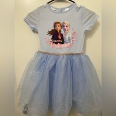 Nwot Disney/H&M Elsa Dress With Chiffon Bottom. In Excellent Condition. Never Worn. Girls Size 8/10 Comes From Smoke Free/Pet Free Home Blue Short Sleeve Princess Dress For Dress-up, Blue Princess Dress With Short Sleeves For Dress-up, Disney Short Sleeve Dresses With Character Print, Cute Blue Princess Dress With Short Sleeves, Blue Short Sleeve Cute Princess Dress, Spring Disney Short Sleeve Dresses, Disney Style Short Sleeve Spring Dresses, Cotton Short Sleeve Dresses With Character Print, Short Sleeve Cotton Dresses With Character Print