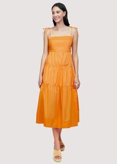 Get ready to turn heads in our Paradiso Midi Dress! Made from soft cotton poplin in a beautiful apricot shade, this dress is a true sun dress silhouette. Its relaxed fit and easy midi length make it the perfect choice for sunny days. Complete your look with sandals and a sun hat. WDWH23282 Imported Lined Self: 100% CottonLining: 100% Rayon Model is 5 ft 9.5 inches; Bust: 32", Waist: 24", Hips: 34" and wearing a size Small Runs true to size Hand wash or wash with gentle cycle with cold water with like colors, Air dry to avoid shrinkage Cotton Midi Sundress For Brunch, Orange Knee-length Summer Midi Dress, Solid Midi Sundress For Brunch, Solid Cotton Sundress For Spring, Orange Midi Sundress For Spring, Solid Spring Midi Sundress, Solid Color Midi Length Sundress For Spring, Solid Color Cotton Maxi Dress For Daywear, Solid Cotton Maxi Dress For Daywear