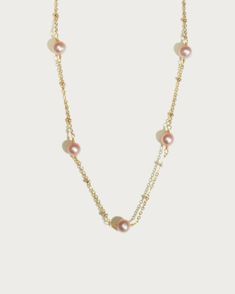 The magic of pearls intertwined with gold plated chain to create a heavenly appearance. This is exactly what you get in Pink Yumi Freshwater Pearl necklace that we have for you. Beautiful to wear on every occasion, this shining piece of jewelry is one of the best accessories you will ever expect to have. If you have been looking for a charmer necklace that comes as a breath of fresh air, then this is exactly what you need. Materials: 18k gold plated brass, freshwater pearl Measurements: 16.5"/41 En Route Jewelry, Pearl Comb, Pearl Collar, Pink Pearl Necklace, Instagram Tags, Freshwater Pearl Necklaces, Gold Plated Chains, Fresh Water, Freshwater Pearls