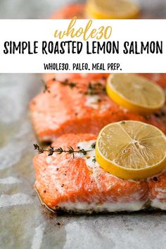 salmon with lemons and herbs on top, sitting on foil in front of the words simple roasted lemon salmon