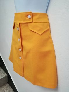 JO SKIRT Handmade skirt 100% Polyester Color: yellow You can choose your own measurements, color or length. You can choose lining, or other special request. Special request are easy, just add this listing to your cart https://www.etsy.com/listing/624364219/special-requests?ref=shop_home_active_25 If you want it on a rush you have priority shipping here, just add the one suits you the best to your cart https://www.etsy.com/shop/swingingchicksshop/items?ref=pagination&section_id=24952619 If yo Fitted Retro Yellow Mini Skirt, Retro Fitted Yellow Mini Skirt, Retro Yellow Fitted Mini Skirt, Fitted Yellow Mini Skort, Retro Yellow Mini Skort, Retro Flared Skort With Lined Skirt, Yellow Pleated Flared Mini Skirt, Fitted Vintage Yellow Skirt, Vintage Yellow Fitted Skirt