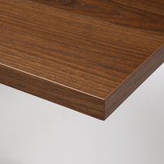 the edge of a wooden table with white background