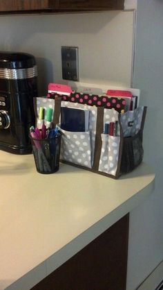 the kitchen counter is cluttered with office supplies