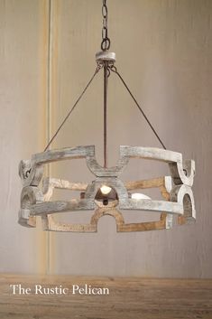 the rustic pelican chandelier is made out of wood planks and metal