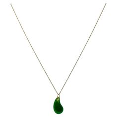 DESIGNER: Elsa Peretti for Tiffany & Co. CIRCA: 1980’s MATERIALS: 18K Yellow Gold GEMSTONE: Jade WEIGHT: 5.3 grams MEASUREMENTS: Chain - 16" Pendant - 13/16" HALLMARKS: Tiffany & Co., 750, Peretti A rare necklace by Elsa Peretti for Tiffany & Co., featuring a teardrop jade pendant and an 18k gold chain necklace. Delicate and smooth, the teardrop pendant is an embodiment of Peretti’s minimalist design philosophy. Being inspired by natural forms, the pendant showcases a polished jade, shaped into Elegant Turquoise Jade Necklace, Luxury Jade Fine Jewelry Necklace, Elsa Peretti Bean Necklace, Elsa Peretti Mesh Necklace, Tiffany Elsa Peretti Necklace, Open Heart Ring, 10k Gold Chain, 18k Gold Chain, Elsa Peretti