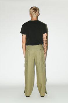 A utility cargo for the ultimate off-duty uniform. Easy-going and relaxed, these cargos are pleated for a slightly wider, straight-leg silhouette. Open the side-zip hems for a sportier 90's aesthetic. Dress down formal blazers and button-ups with an effortless, casual contrast. Combat Style Wide Leg Bottoms With Cargo Pockets, Combat Style Wide-leg Bottoms With Cargo Pockets, Combat Style Relaxed Fit Bottoms With Side Pockets, Wide Leg Combat Bottoms With Cargo Pockets, Combat Style Bottoms With Side Pockets And Relaxed Fit, Relaxed Fit Combat Bottoms With Side Pockets, Combat Bottoms With Side Pockets Relaxed Fit, Combat Style Straight Leg Bottoms With Multiple Pockets, Military Style Straight Leg Parachute Pants For Streetwear