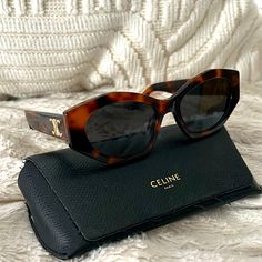 Sleek, Angular Frames Elevate These Eye-Catching Italian-Made Sunglasses Fitted With Smoky Lenses For A Look Of Alluring Glam. 55mm Lens Width; 19mm Bridge Width; 145mm Temple Length 100% Uv Protection Tortoise Immaculate Condition, Gently Worn Celine Triomphe Sunglasses, Celine Accessories, Celine Triomphe, Tortoise Color, Tortoise, Sunglasses Accessories, Uv Protection, Black And Brown, Temple