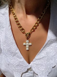 A handmade gold necklace with a unique Cross charm at the center that has a white type of stones on it that are made from enamel. The connection is at the front side with a circle part so it can not be adjusted. In Christina Christi Jewels store you can see more than 50 designs in Women's Necklaces. You can have them in 2-4 Days with DHL EXPRESS SHIPPING MATERIALS - Gold filled Chains are made from Aluminium. - White Cross charm made from brass with White type of stones on it (enamel). DIMENSION Enamel Pendant Necklaces, Handmade Yellow Gold Enamel Necklaces, Handmade Yellow Gold Enamel Necklace, White Cross Chain Jewelry, White Cross-shaped Chain Jewelry, Handmade Gold Enamel Necklaces, Handmade White Gold-plated Jewelry, Gold Enamel Necklace With Adjustable Chain, White Cross Jewelry For Gift