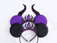 a purple and black mickey mouse ears headband