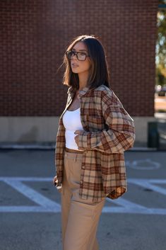 Feel cozy yet classic in this luxe plaid top featuring a collared neckline with button closures and pocket detail for that added touch of sophistication. The rounded hem offers a relaxed fit perfect for any Fall outings like shopping errands, brunch, and even bonfires. A must-have transition piece that is trendy and elevated, this Backroads Bonfire Plaid Top is an essential for any warm and cozy weekend. 90% Polyester 10% Wool Hand wash cold. Classic Button-up Flannel Shirt For Fall, Relaxed Fit Flannel Shirt For Workwear In Fall, Classic Tops For Day Out In Fall, Plaid Flannel Shirt For Fall Day Out, Fall Flannel Shirt With Long Sleeves For Day Out, Casual Fall Flannel Shirt For Day Out, Everyday Plaid Flannel Shirt With Pockets, Casual Flannel Shirt For Fall Day Out, Classic Plaid Flannel Shirt For Everyday