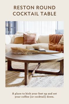 a living room filled with furniture and pillows on top of a wooden table in front of a window