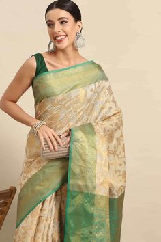 Product Features: Saree: Saree as seen in picture - Choose the drape style while order: Standard, Pleated or Gujarati Saree Color: Green Saree Fabric: Banarasi Art Silk Saree Style: Banarasi Saree Work: Floral Saree Pattern: Regal Weave Saree Print: floral zari woven Blouse: Blouse design must be chosen while ordering. For the blouse in pic, please choose the selection "As seen in picture" or customize your selection. Blouse Color: Green Blouse Fabric: Banarasi Art Silk Blouse Print or Pattern: Pre-draped Saree For Puja Festivals, Transitional Traditional Wear With Zari Work, Designer Wear Pista Green Saree, Eid Pre-draped Saree With Self Design, Pre-draped Saree For Eid, Self Design Pre-draped Saree For Eid, Self-design Pre-draped Saree For Eid, Pista Green Blouse Piece For Transitional Season, Zari Weaving Lehenga For Puja