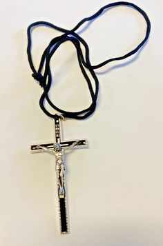 ITEM # AB-80You are purchasing a nice black enamel crucifix that measures approximately 3.50" comes with a 30" black cord. This is a perfect gift , or for you to wear. Please visit our other Ebay listing to find more books and DVDS written by Bob and Penny Lord and all of our other religious items. If you have any questions please let us know. We will combine shipping if you buy more than 1 item. God bless you. Listed with ExportYourStore.com Perfect Gif, God Bless You, Pitcairn Islands, Turks And Caicos Islands, Black Enamel, God Bless, Trinidad And Tobago, Uganda, Written By