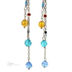 Blue and yellow multi-beaded dangle earrings Materials: .925 Sterling Silver, Multicolored Beads Dimensions: 93mm length Multicolor Long Drop Earrings With Colorful Beads, Long Drop Beaded Chain Earrings As Gift, Multicolor Czech Glass Dangle Earrings, Multicolor Czech Glass Drop Earrings, Yellow Dangle Earrings With Faceted Beads, Silver Dangle Jewelry With Colorful Beads, Silver Sterling Beaded Earrings With Colorful Beads, Blue Beaded Long Drop Jewelry, Multicolor Long Drop Beaded Jewelry