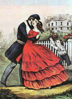 a man and woman are kissing in front of a picket fence