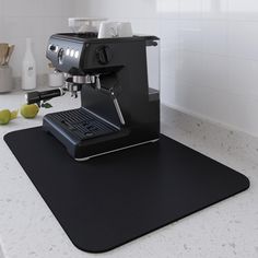 an espresso machine sitting on top of a counter