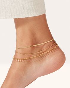 The look of an anklet stack in one easy-to-wear, water-durable design. The Surfside Anklet boasts a slinky herringbone snake chain and is paired with a stamped curb chain for modern, textural interest. Finished in high-polish gold. gold ion plated steellobster claspfinish: high polish product measurements:wearable between 21.59 cm / 8.5" and 27.31cm / 10.75"top chain width: 2mm / 0.08"bottom chain width: 1.5mm / 0.06"weight: 2.94g / 0.1ozstyle: JB759-HPGimported Gold Anklet Stack, Anklet Stack, 14k Gold Ear Cuff, Ankle Bracelets Boho, Body Accessories, Outfit Combos, Gold Bubbles, Ankle Jewelry, Gold Anklet